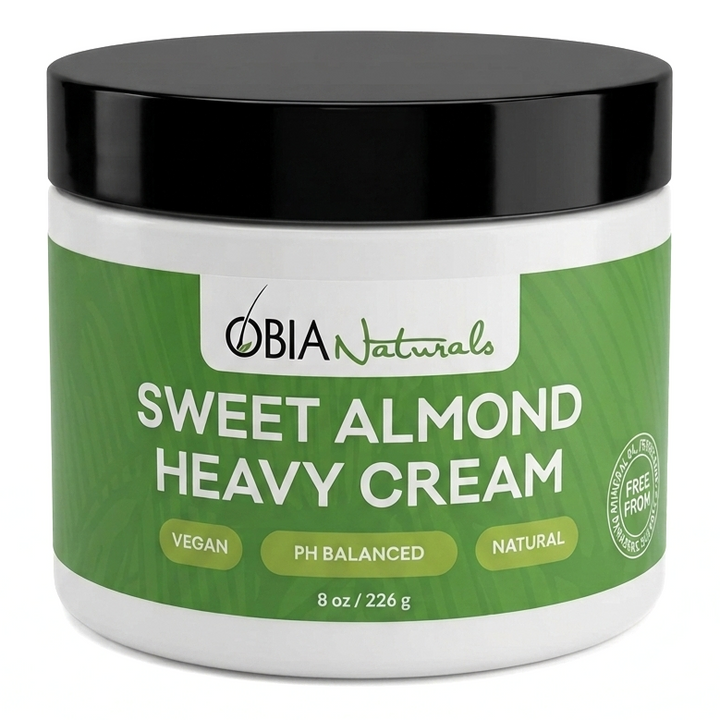 OBIA Naturals Sweet Almond Heavy Cream bottle — rich, vegan leave-in conditioner for dry, coarse hair
