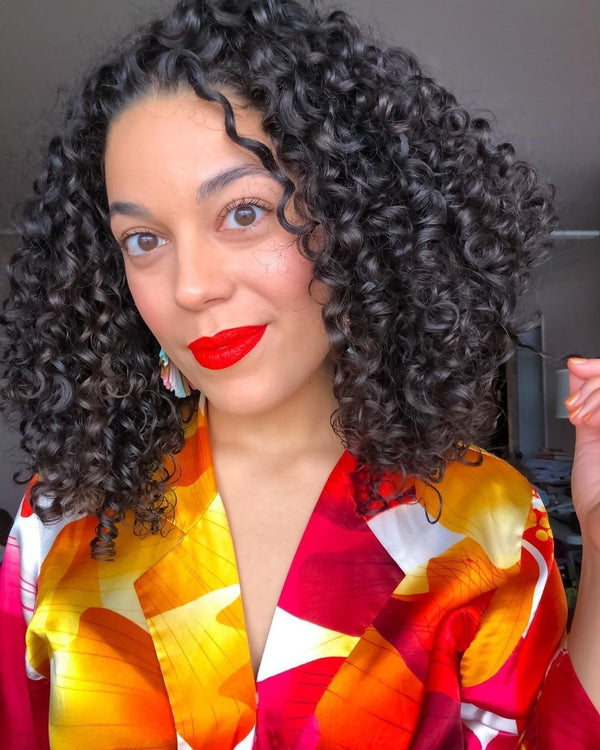 Customer's defined curls with OBIA Curl Enhancing Custard