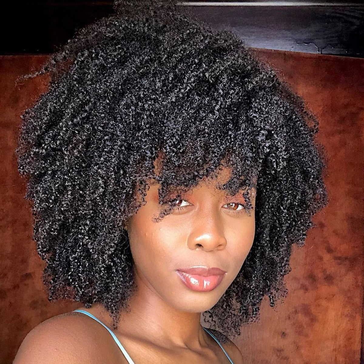 Customer with a full, defined curly fro